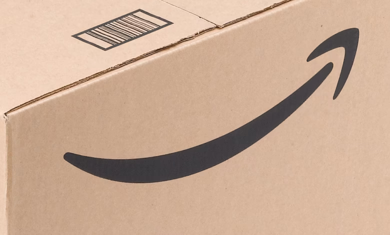 Close-up of an Amazon shipping box, featuring the iconic Amazon smile logo and a barcode.