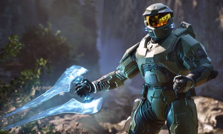 Master Chief, Halo's iconic Spartan, wields an energy sword, poised for battle in a lush, rocky landscape.