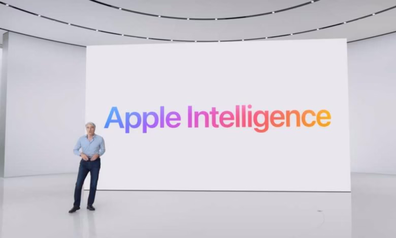 A man stands on a stage in front of a large screen displaying the Apple Intelligence logo.