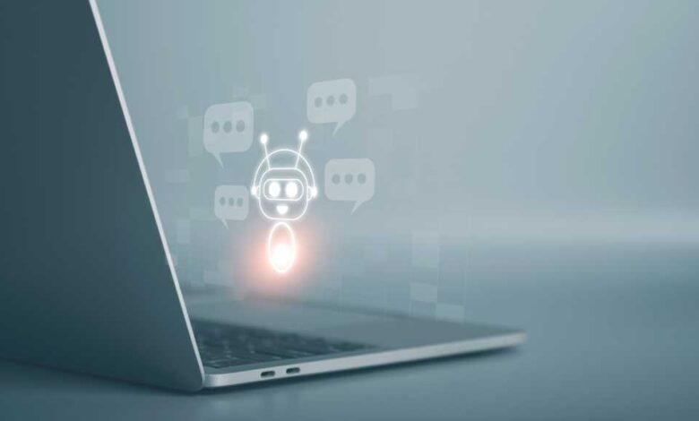 Laptop screen displays a chatbot icon surrounded by speech bubbles, symbolizing AI-powered customer service.
