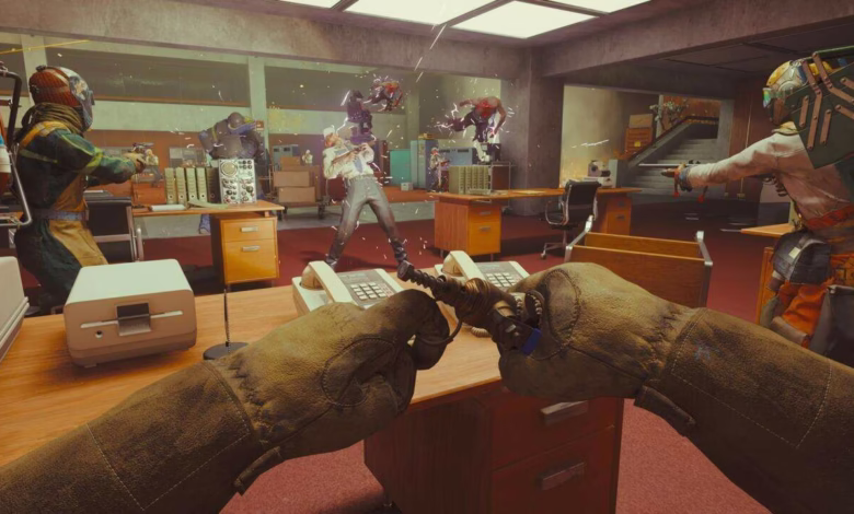 First-person view of a video game, showing a player wielding a strange device amidst a chaotic office scene with robotic enemies.