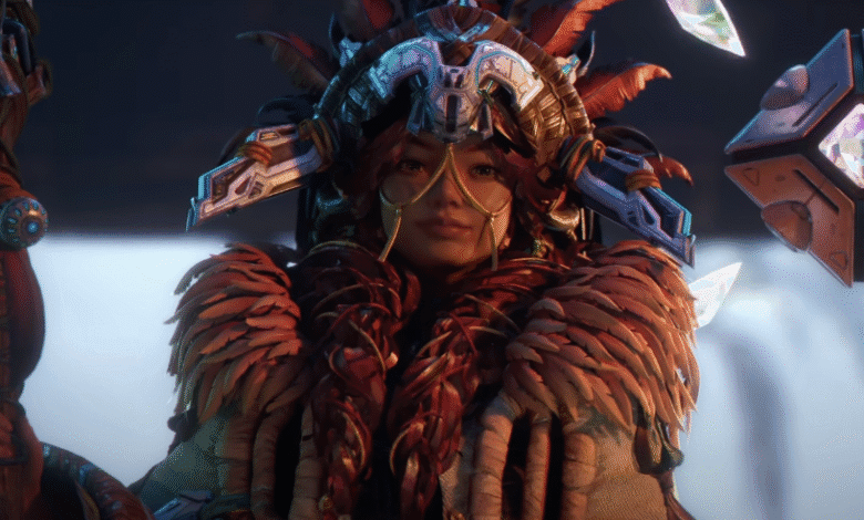 A female character in a richly detailed, ornate headdress and feathered attire holds a staff, gazing intently. A glowing cube floats nearby.