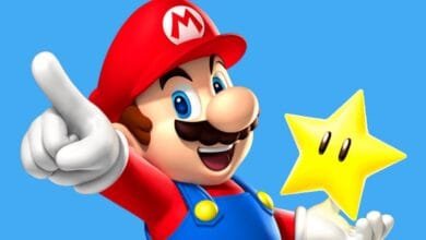 Super Mario, iconic video game character, points excitedly while holding a golden star against a bright blue background.