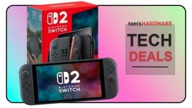 Nintendo Switch OLED model with special edition gray and coral joy-cons displayed with its box. Tom's Hardware Tech Deals banner.