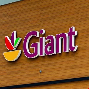 Giant grocery store logo on a wood-paneled building.