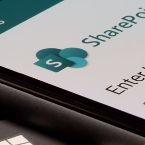 Close-up of a smartphone displaying the SharePoint app login screen.