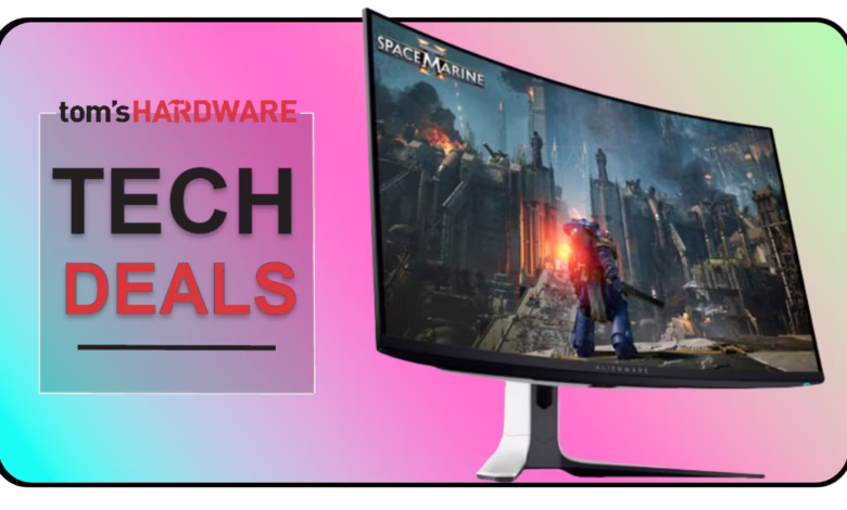 Curved gaming monitor displaying Space Marine, advertised with Tom's Hardware 'Tech Deals'