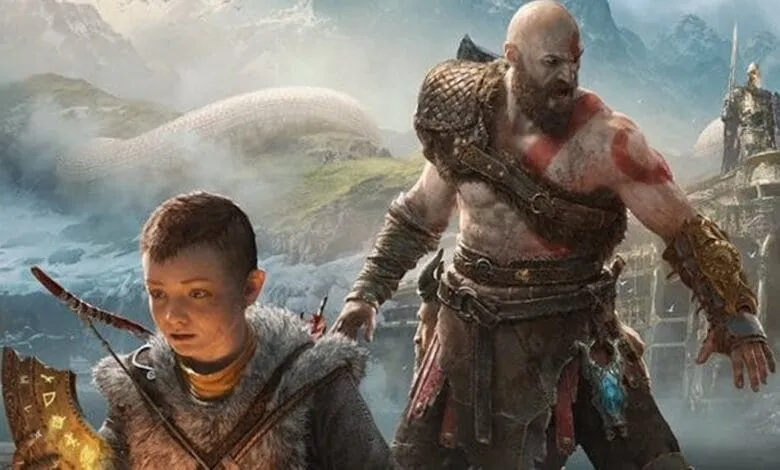 Kratos and Atreus traverse a snowy mountain, showcasing their bond in God of War.