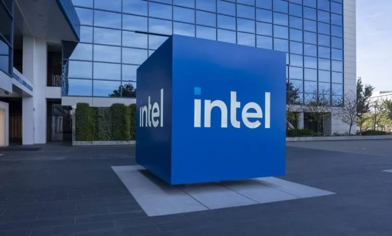 Large blue Intel sign outside modern building.