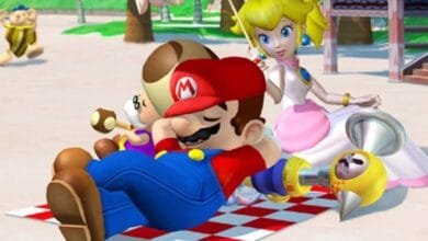 Mario, Peach, and Toad relaxing on a beach blanket, enjoying a sunny day.