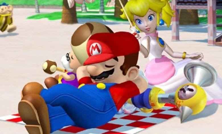 Mario, Peach, and Toad relaxing on a beach blanket, enjoying a sunny day.