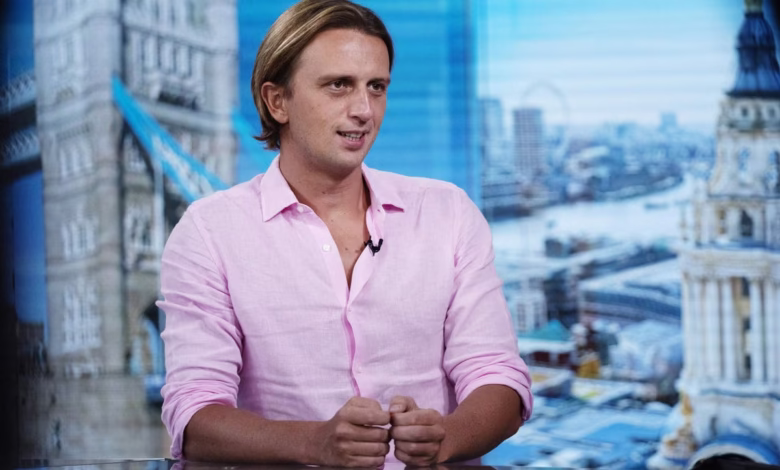 Nikolay Storonsky, CEO of Revolut, sits for an interview against a backdrop of London landmarks.