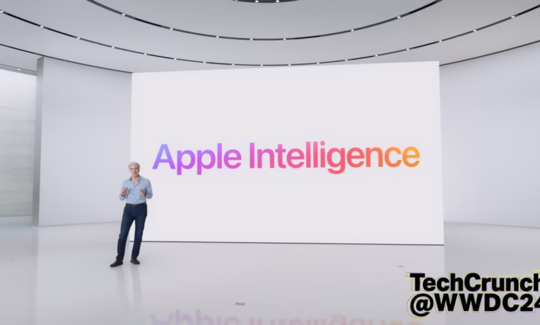 A man presents Apple Intelligence at WWDC24. The large screen displays the logo in a gradient.