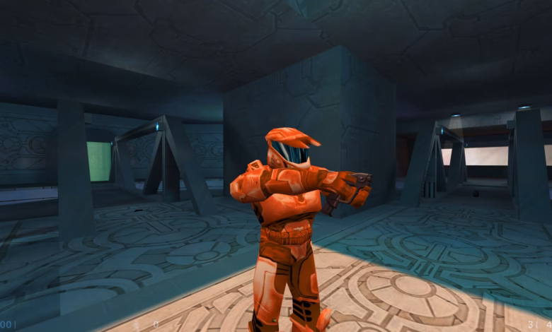 Orange-suited video game character holds a weapon in a futuristic, teal-colored environment.