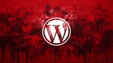 WordPress logo in white, centered on a red background with dark red paint splatters.