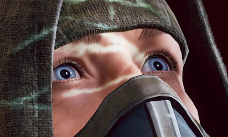 Close-up of a person's wide, surprised eyes, partially obscured by a camouflage hood and face mask.