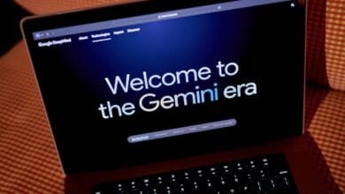 Laptop screen displays 'Welcome to the Gemini era' on a dark background, suggesting a new AI technology launch.