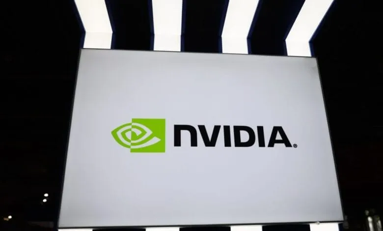 NVIDIA logo displayed on a large white sign, set against a dark background with illuminated stripes above.