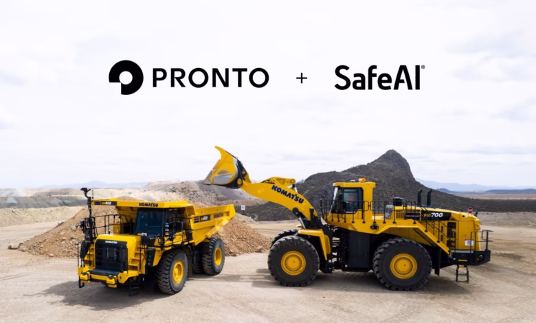 Two yellow Komatsu mining trucks operate in a quarry; Pronto and SafeAI logos are displayed above.