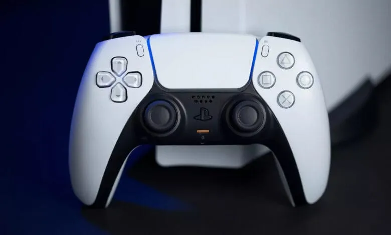 Close-up of a white PlayStation 5 DualSense controller, showcasing its buttons and sleek design.