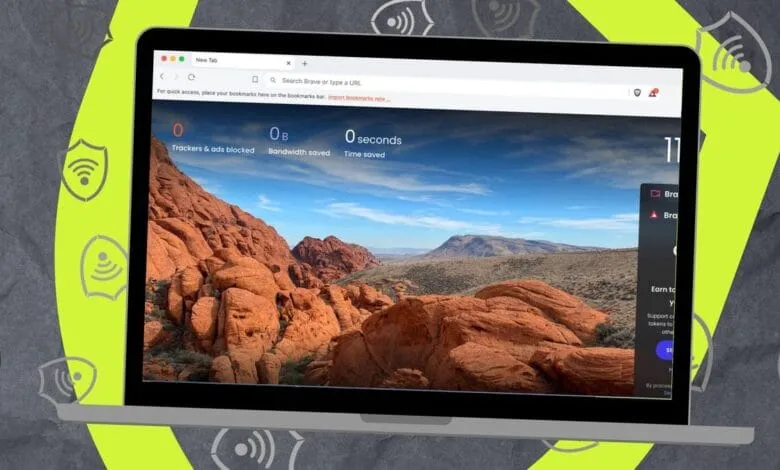 Laptop displaying Brave browser's new tab page with a desert landscape and privacy stats.