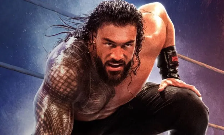 Roman Reigns, WWE wrestler, intensely stares at the camera, kneeling in a wrestling ring.