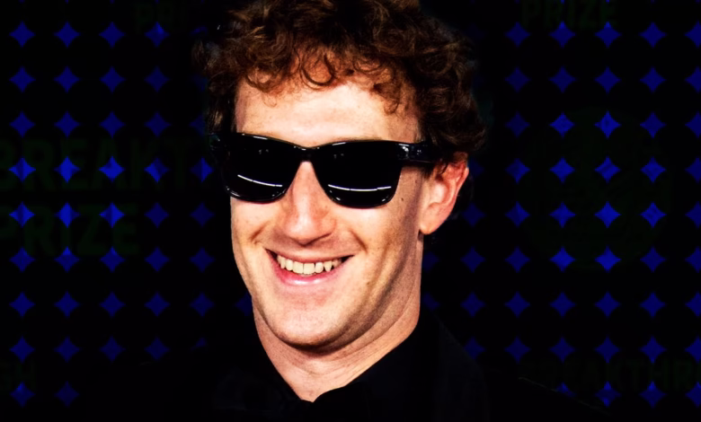 Close-up portrait of Mark Zuckerberg, CEO of Meta, smiling and wearing sunglasses against a dark blue background.