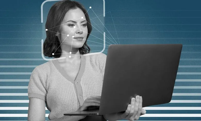 A woman uses a laptop, her face overlaid with a facial recognition scan graphic. The background is teal with horizontal stripes.