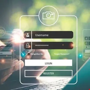 Close-up of hands holding a smartphone, logging into an account on a digital interface with username and password fields.
