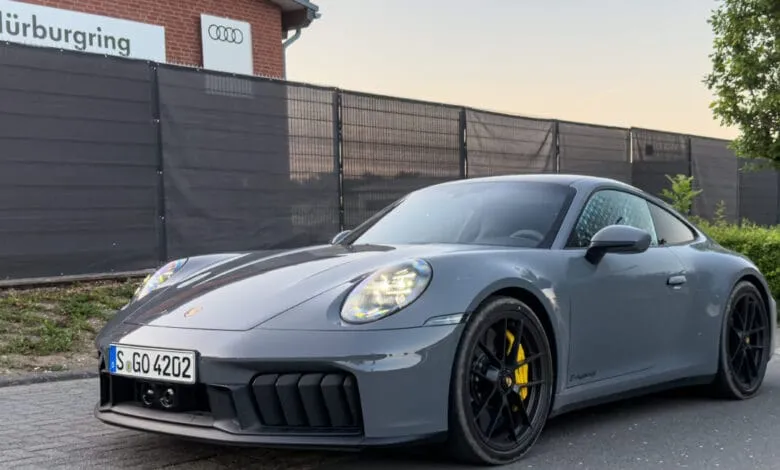 Gray Porsche 911 GTS Hybrid parked near the Nürburgring.