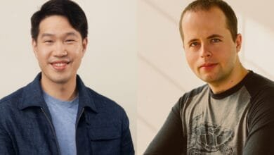 Headshots of two men, one in a dark blue jacket and the other in a grey raglan shirt with a turtle graphic.