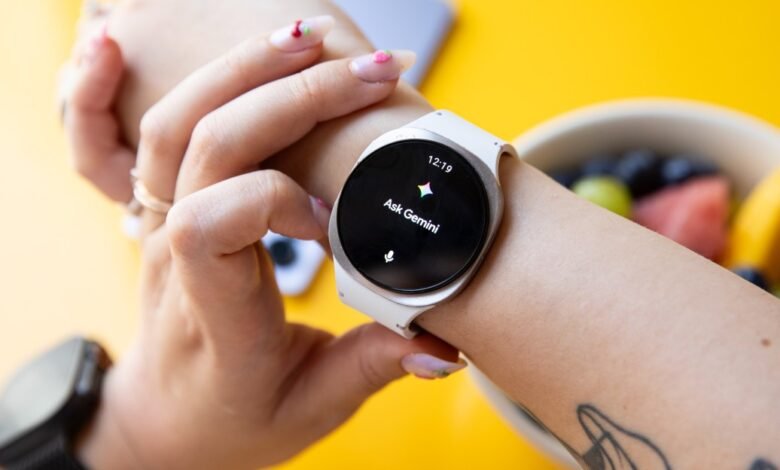 A person's wrist displaying a white Galaxy Watch 8 with the Google Gemini AI assistant interface visible.