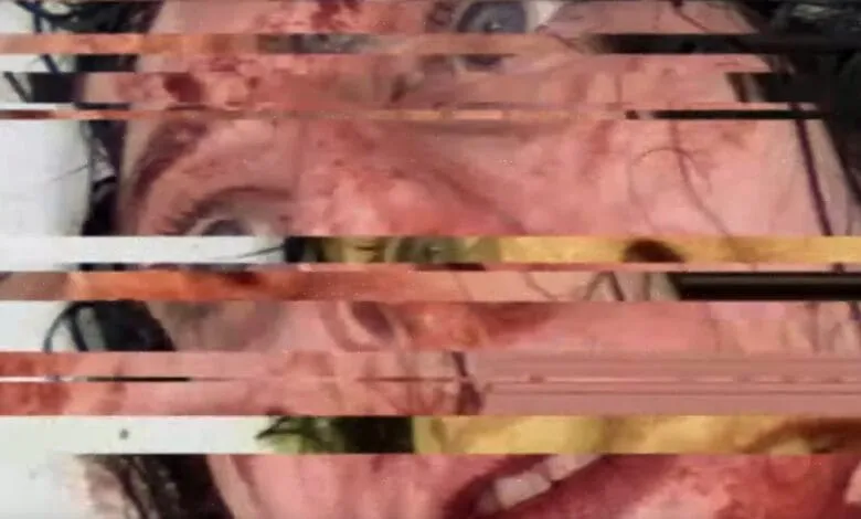 Distorted close-up of a face with visible injuries, showing bleeding and bruising.