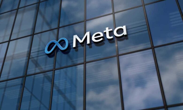 Meta logo on a modern glass building. The logo is a stylized infinity symbol and the word 'Meta'.