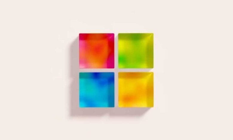 Colorful, translucent squares arranged in a 2x2 grid, resembling the Windows 11 logo.