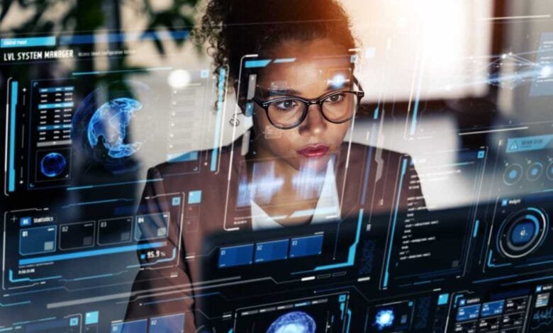 Focused woman reviewing complex data visualizations on a large screen, showcasing AI-powered analytics.