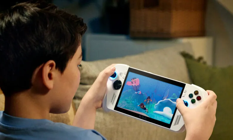 Boy engrossed in a vibrant video game on a white handheld console.