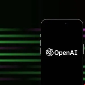 OpenAI logo displayed on a smartphone screen against a dark background with green and purple streaks.