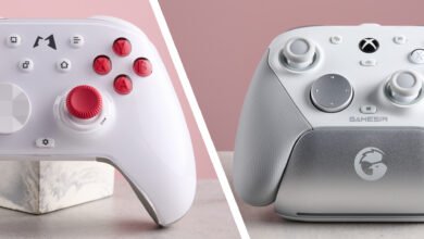 Comparison of two white gaming controllers: one with red accents, the other silver. Both are sleek and modern.