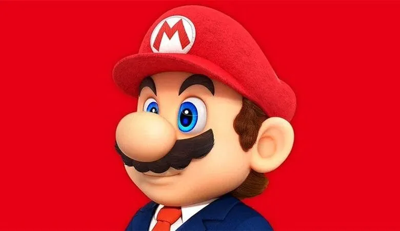 Close-up of Mario in a suit, against a red background. He's wearing his signature hat.