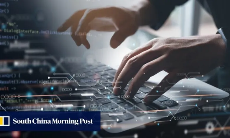 Close-up of hands typing code on a laptop, with a digital overlay of circuit lines. Software development concept.