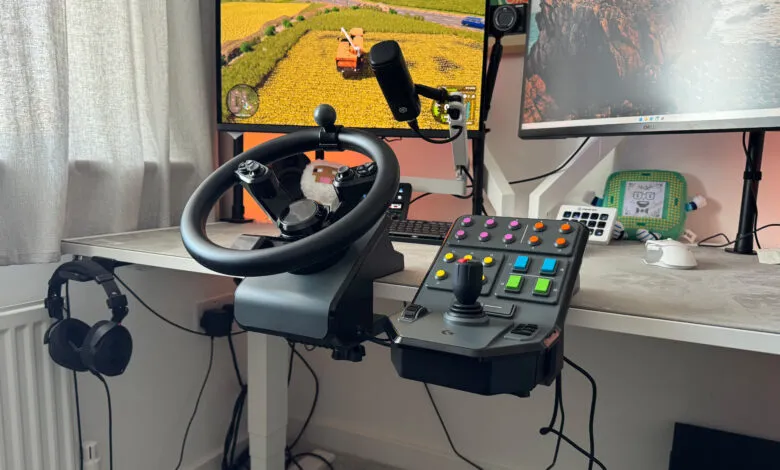 Gaming setup with racing wheel, joystick, and multiple monitors displaying a farming simulator game.