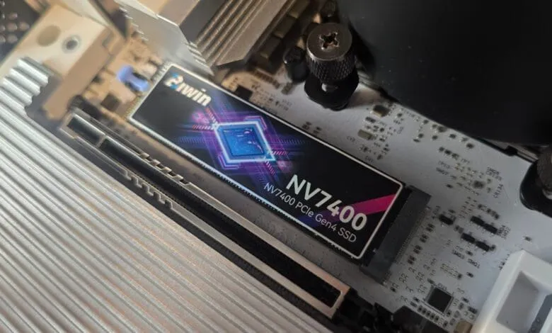 Close-up of a Piwin NV7400 PCIe Gen4 SSD installed on a computer motherboard.