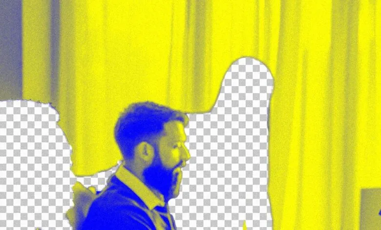 Profile of a man with a beard, rendered in blue and yellow, with a checkered background.