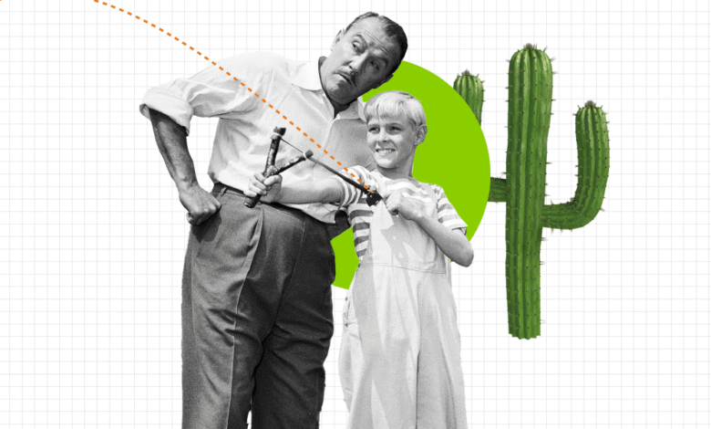 Man teaching boy to use a slingshot with cactus and trajectory line