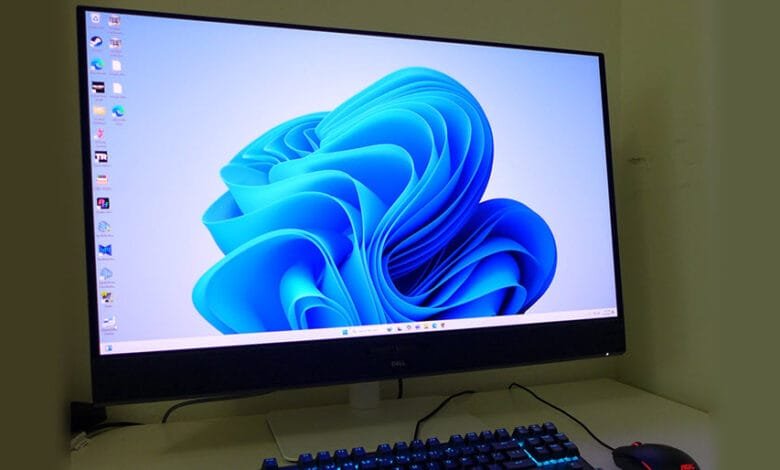 Windows 11 desktop on a Dell monitor with a keyboard and mouse.