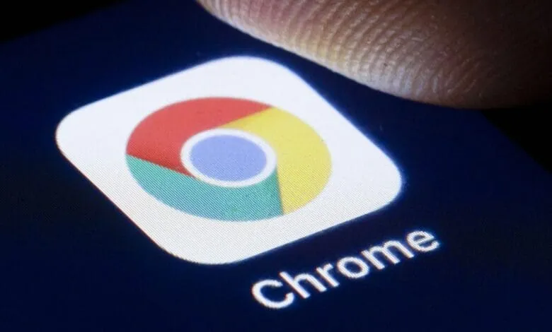 Close-up of a finger touching the Google Chrome app icon on a smartphone screen.