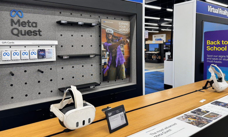 Meta Quest VR headset display in a retail store, showing gift cards and a promotional poster.