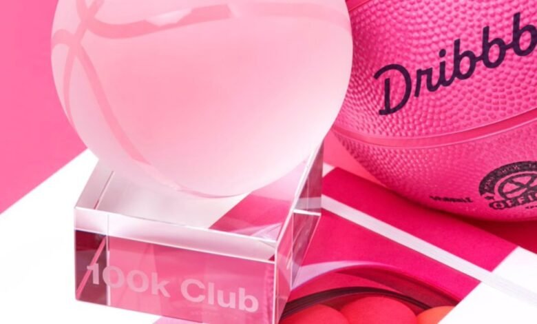 Pink basketball and glass award on pink background. The award reads '100k Club'.