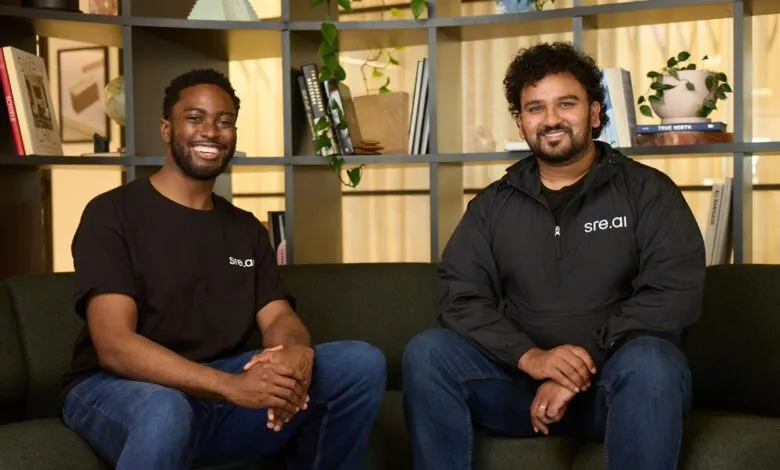 Edward Aryee and Raj Kadiyala, founders of sre.ai, smiling and sitting on a couch.